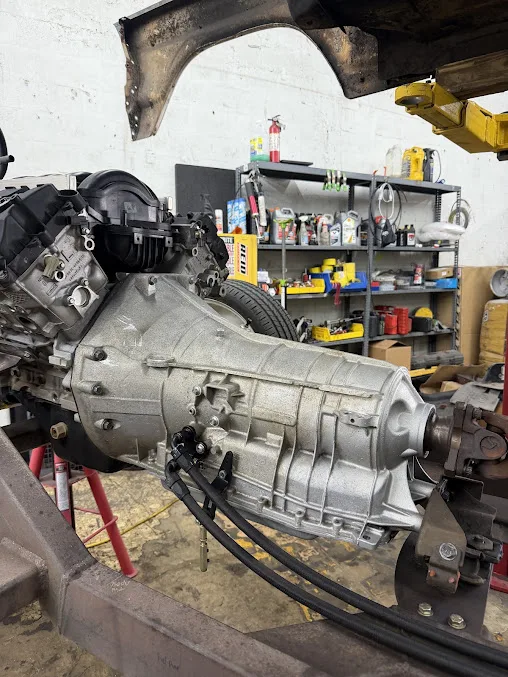 A gearbox and bellhousing assembly on a stand